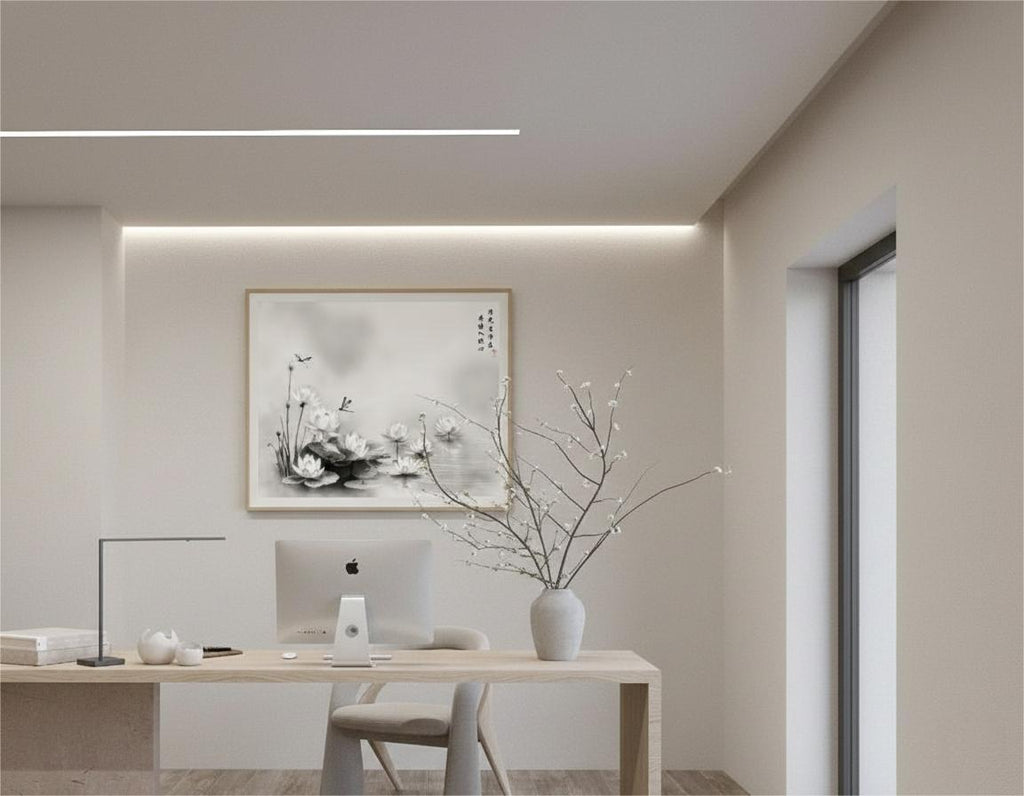 Lotus Grace Clear Light ink painting in a light wood frame above a desk in a home office.