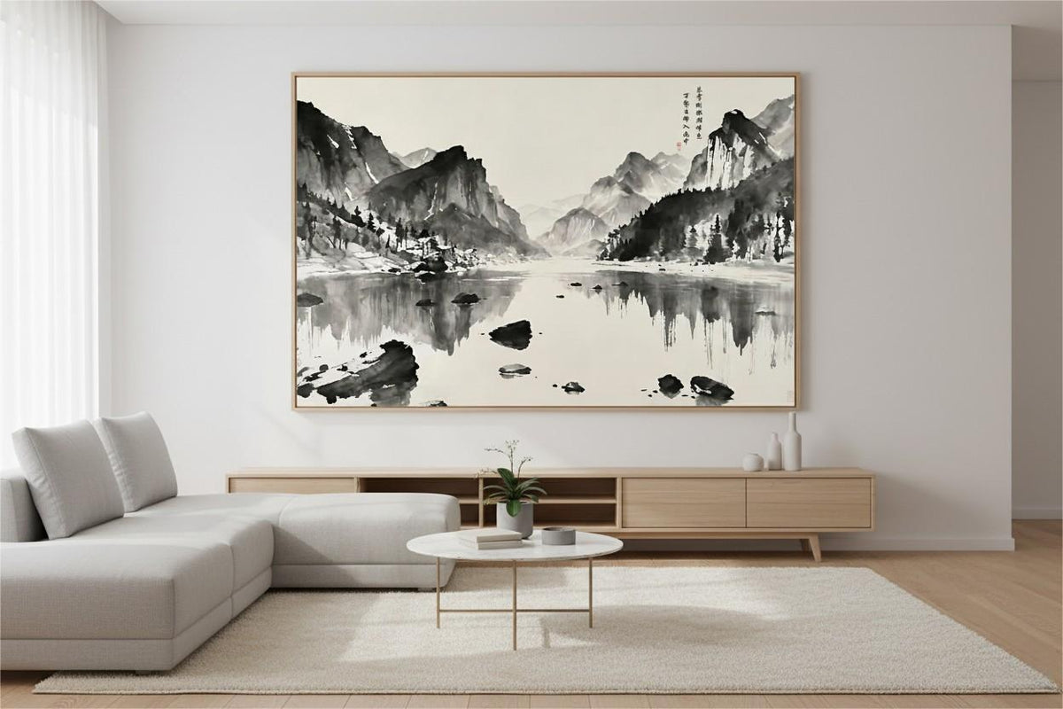 Heaven Reflects Upon Mountains and Rivers ink painting framed above a low sideboard in a minimalist living room